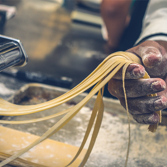 Person holding pasta